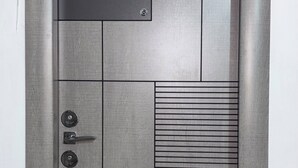 A door with a textured surface, a numeric keypad, a keyhole, and a handle. -  Home Away From Home: Bright Quiet Fully Equipped Self Check-In Central Location (Râmnicu Vâlcea)