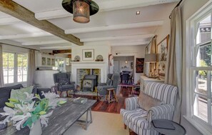 TV, fireplace, books