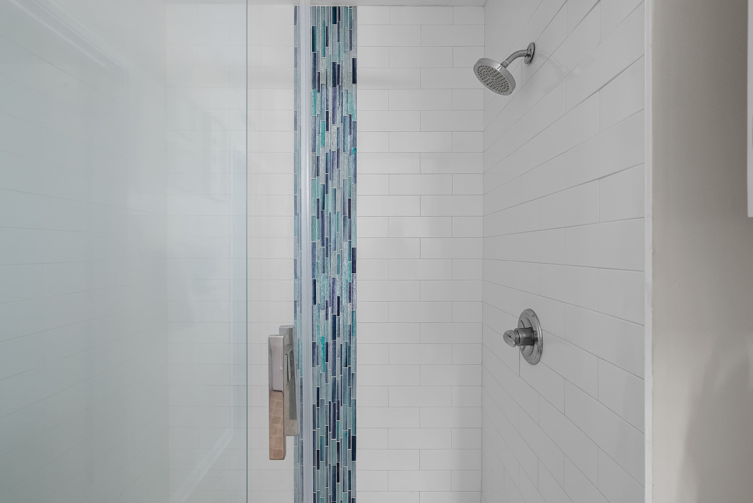 Shower, hair dryer, towels, shampoo