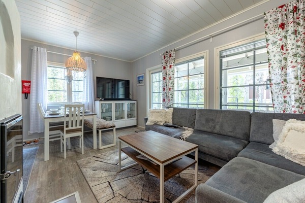 Enjoy open-concept living that seamlessly connects the dining area and kitchen, making it effortless to socialize and share meals after a long day of exploring. The bright layout ensures everyone has a comfortable spot to unwind together.