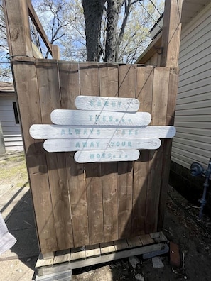 A wooden gate with a sign that reads 'Always Away Your Bosses.'