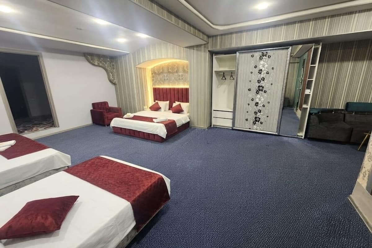 Premium bedding, desk, laptop workspace, soundproofing