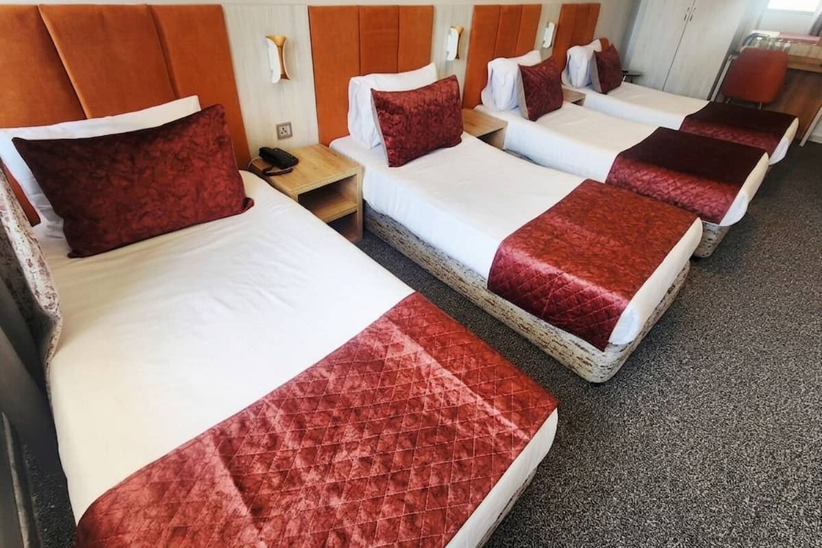 Economy Quadruple Room | Premium bedding, desk, laptop workspace, soundproofing