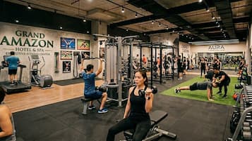A gym with various exercise equipment, including treadmills and weight machines.