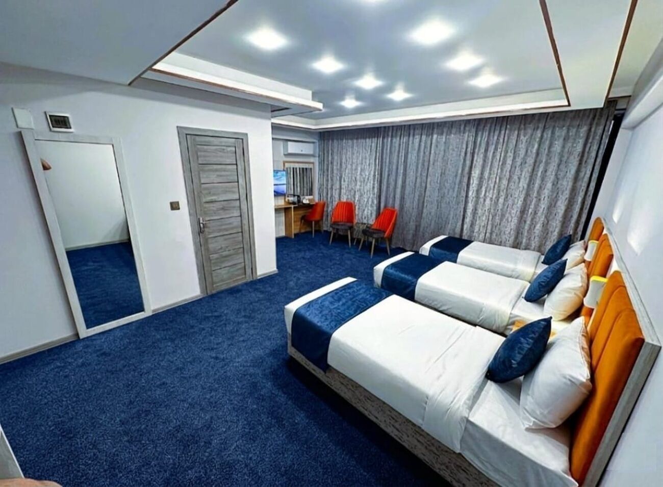 Premium bedding, desk, laptop workspace, soundproofing