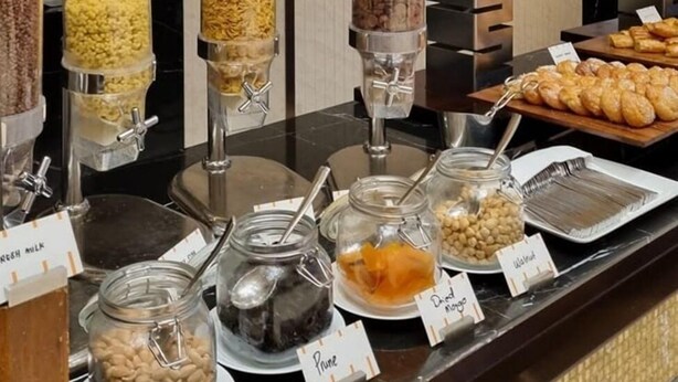 A buffet with various food items, including cereals, nuts, and pastries. - Amazon Hotel - Full Board, Breakfast, Lunch & Dinner Included (Baku)