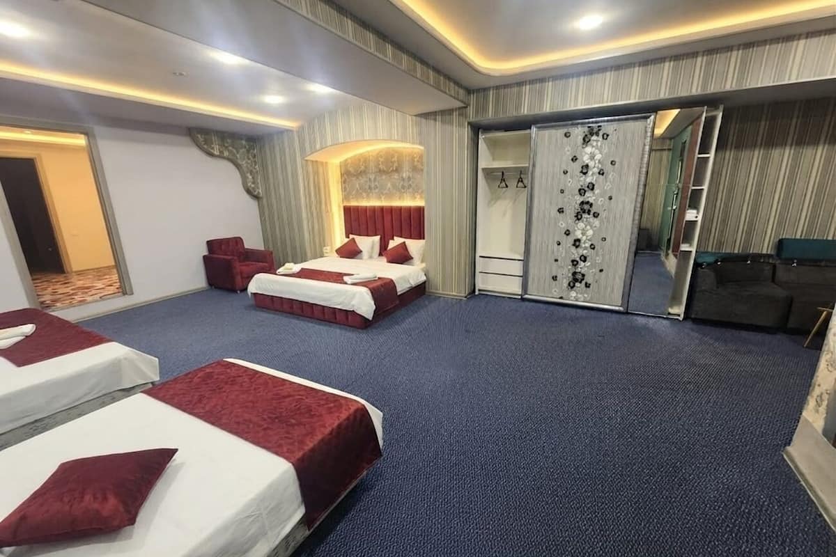 Premium bedding, desk, laptop workspace, soundproofing