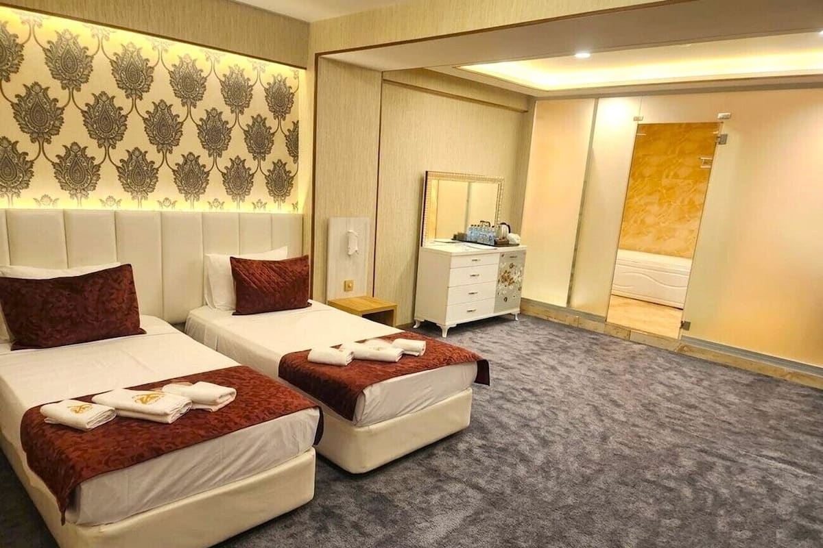 Premium bedding, desk, laptop workspace, soundproofing