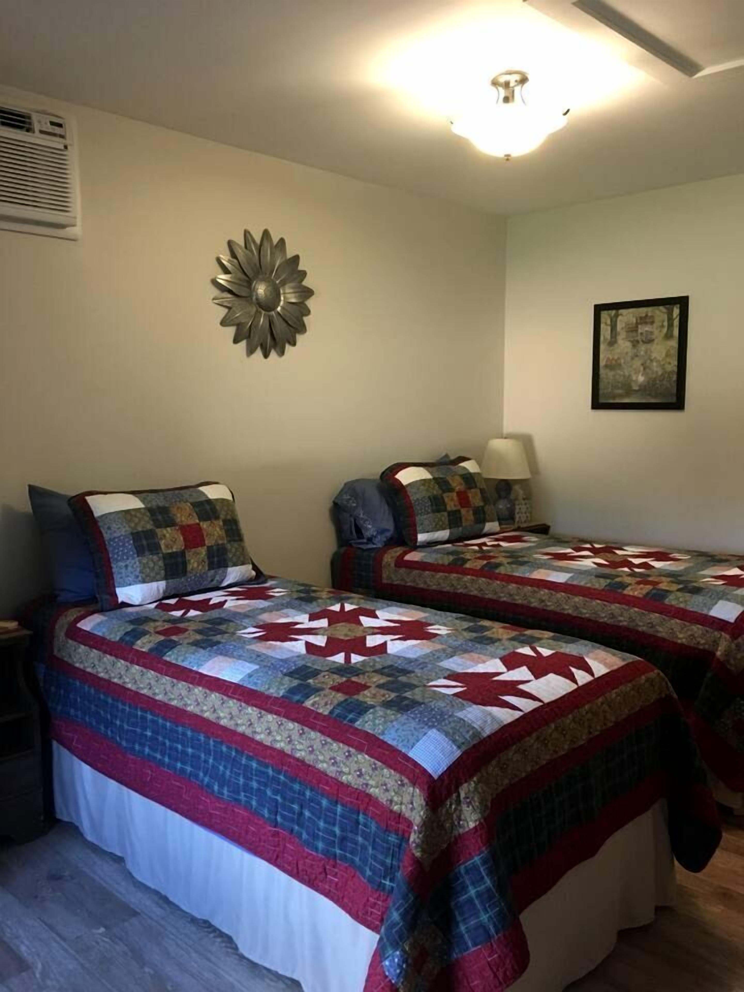 1 bedroom, desk, iron/ironing board, travel crib