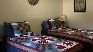 1 bedroom, desk, iron/ironing board, travel crib
