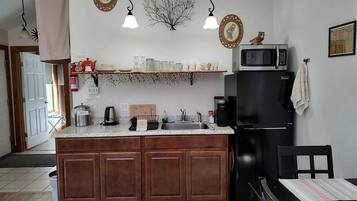 Fridge, microwave, stovetop, coffee/tea maker