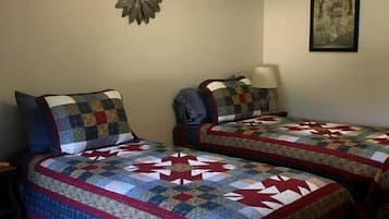 1 bedroom, desk, iron/ironing board, travel crib
