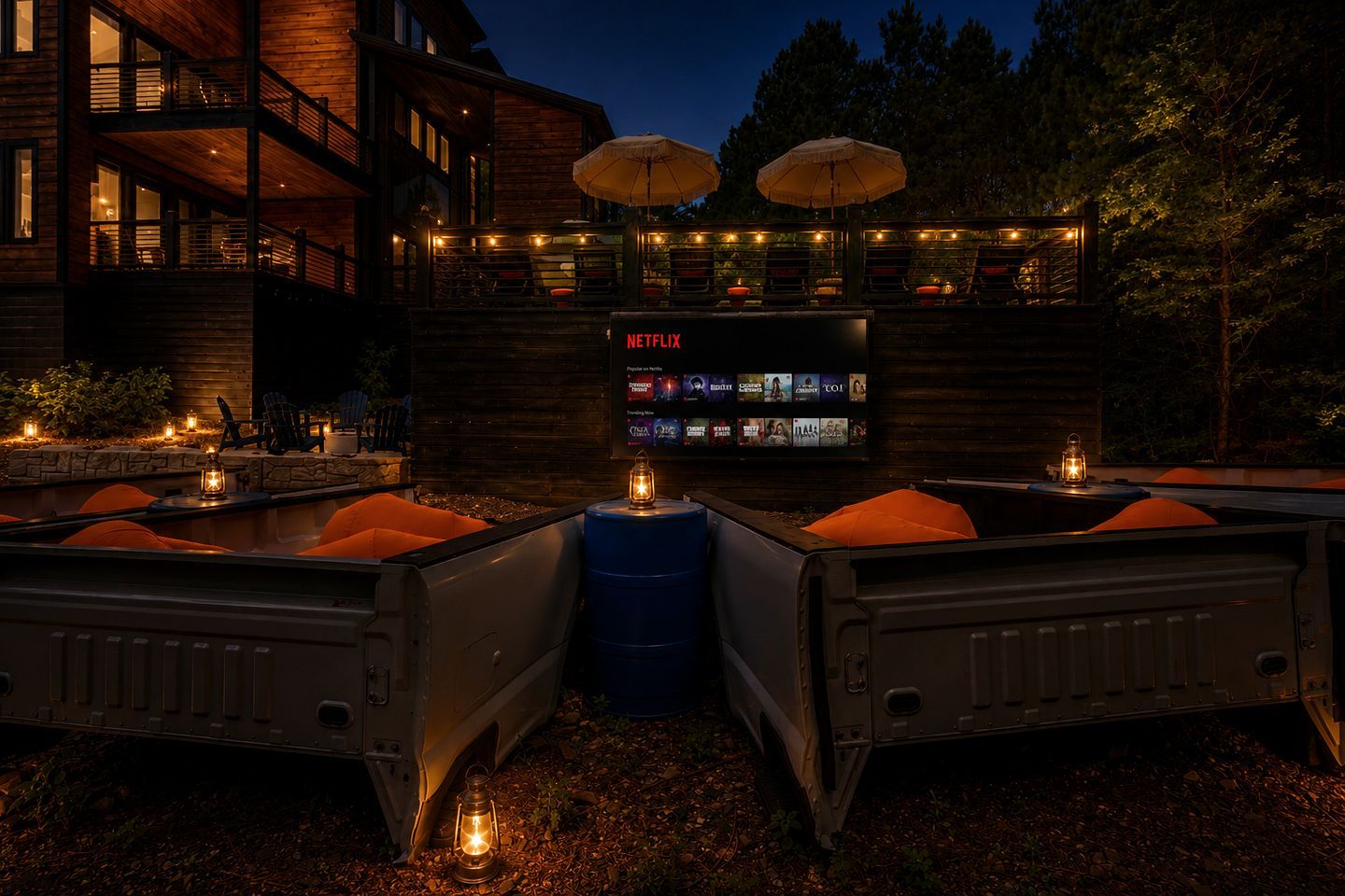 A wooden cabin with a Netflix screen, outdoor seating, and lanterns.