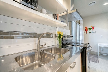 Fridge, microwave, oven, stovetop. Charming Nature-Immersed Guest House with Relaxing Outdoor Lounge Area in Ontario, Canada