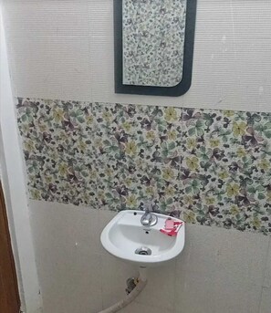 Habitación Deluxe | Baño | Ducha, jabón y champú