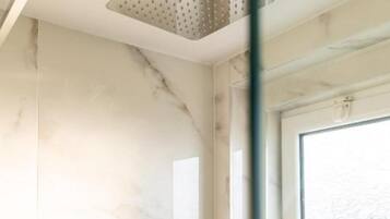 Deluxe Triple Room, Balcony | Bathroom | Shower, hair dryer, towels, soap