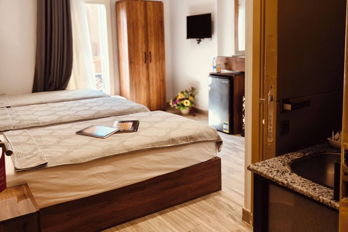 Luxury Triple Room, City View | In-room safe, blackout drapes, iron/ironing board, free WiFi