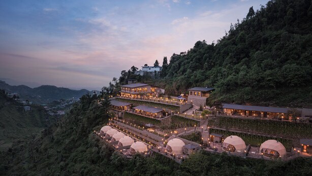 A hillside hotel with multiple levels, interconnected walkways, and dome-shaped accommodations. - Samsara Hill Resort By Leisure Hotels (Mussoorie,)