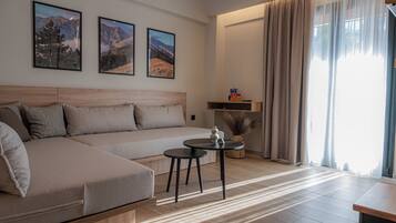 Deluxe Room - Split Level with Mountain View & Sea View | Living area | 43-inch Smart TV with digital channels