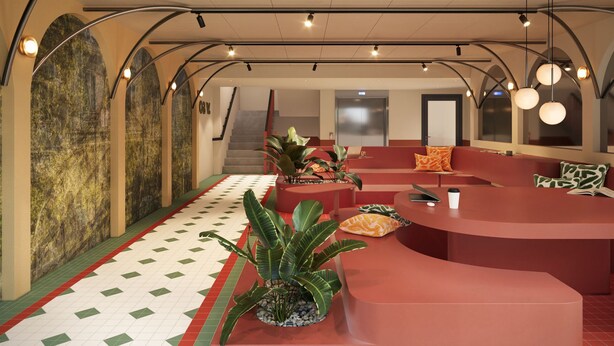 A modern lobby with a curved reception desk, seating areas, and a staircase. - Bob W Vienna Döbling (Vienna)