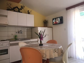 Apartment (A2) | Private kitchen | Fridge, stovetop, cookware/dishes/utensils, cleaning supplies - Apartments Godo (Hvar)