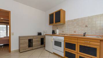 Apartment (A2) | Private kitchen | Espresso maker, fridge, oven, stovetop