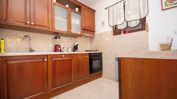 Apartment (A1) | Private kitchen | Espresso maker, fridge, oven, stovetop