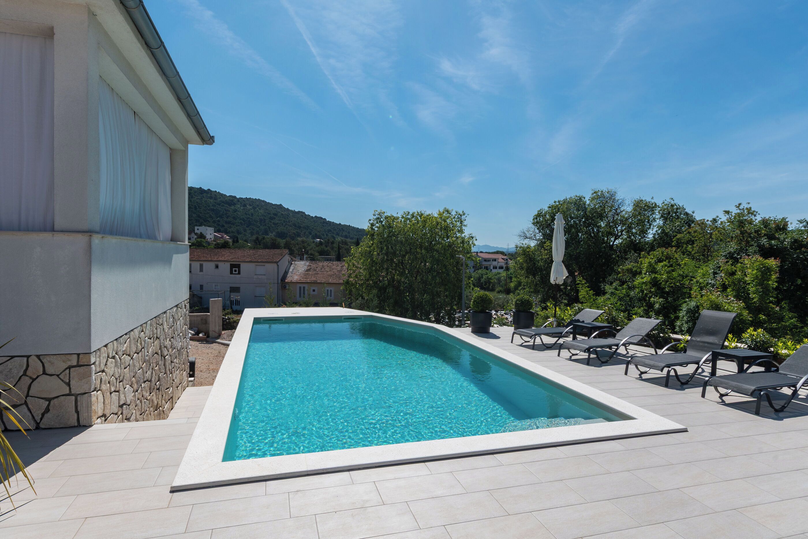 Outdoor pool, pool umbrellas, pool loungers