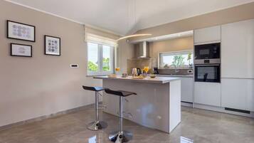 Villa | Private kitchen | Espresso maker, microwave, oven, stovetop