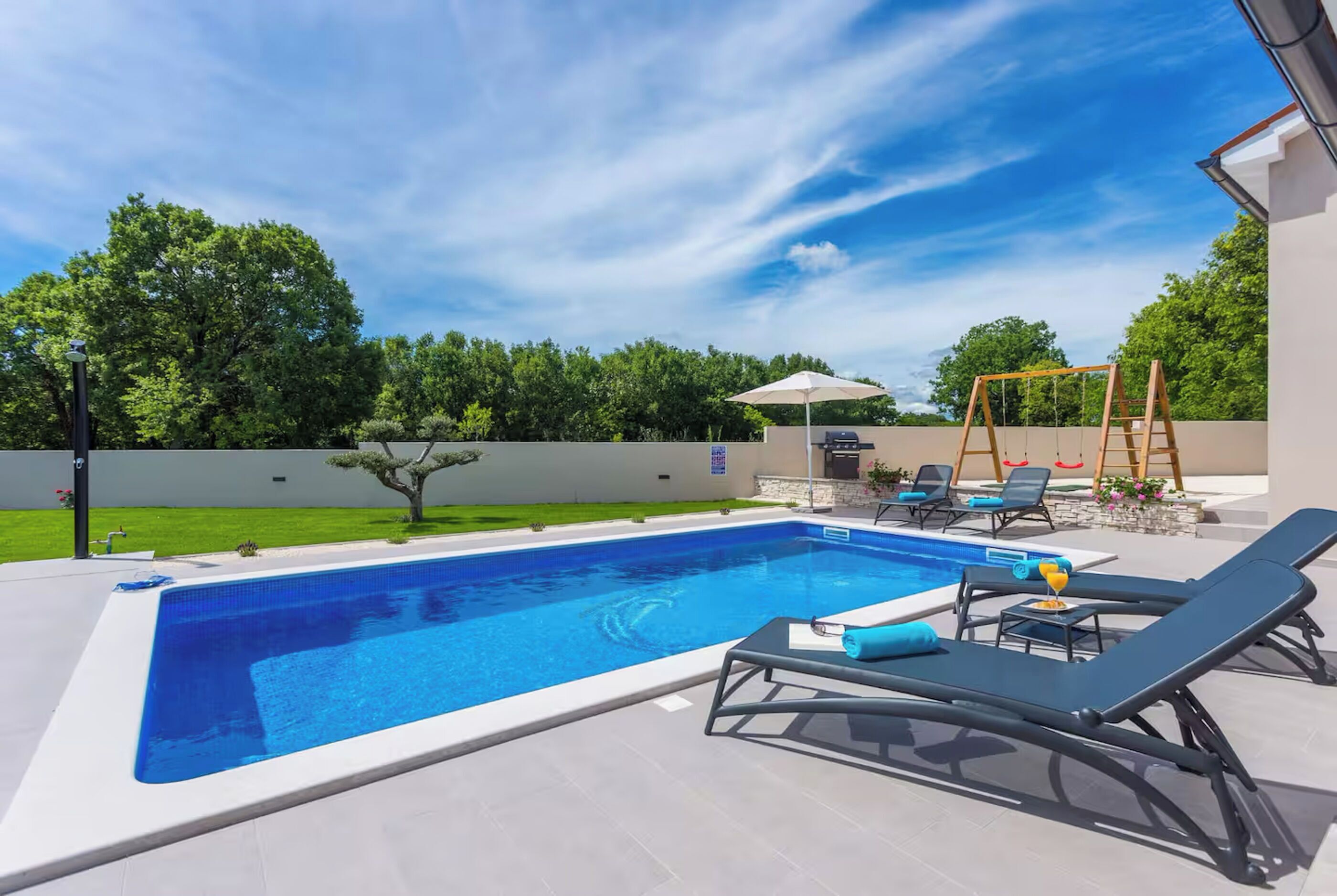 Outdoor pool, pool umbrellas, pool loungers