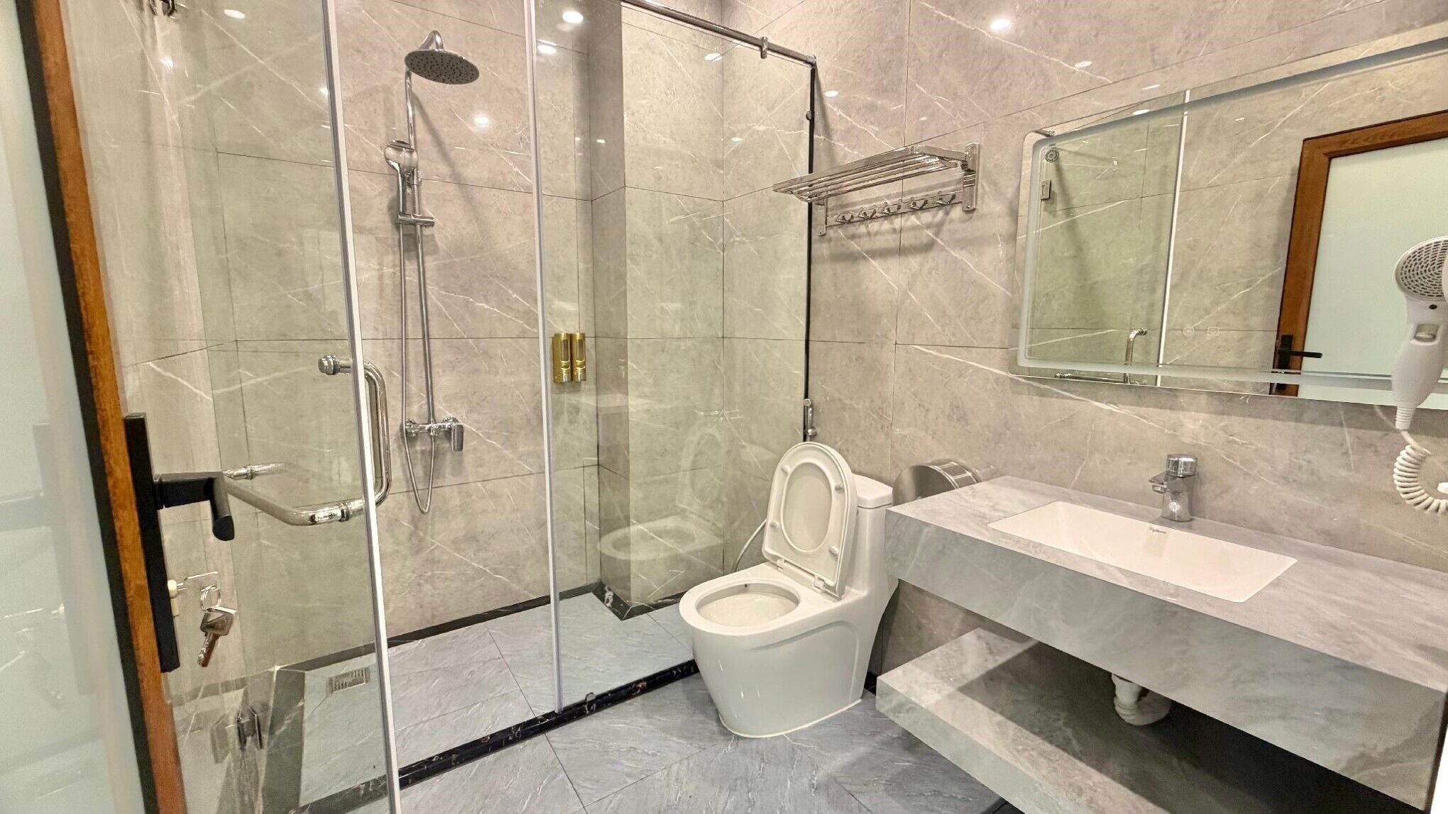 Shower, free toiletries, hair dryer, slippers