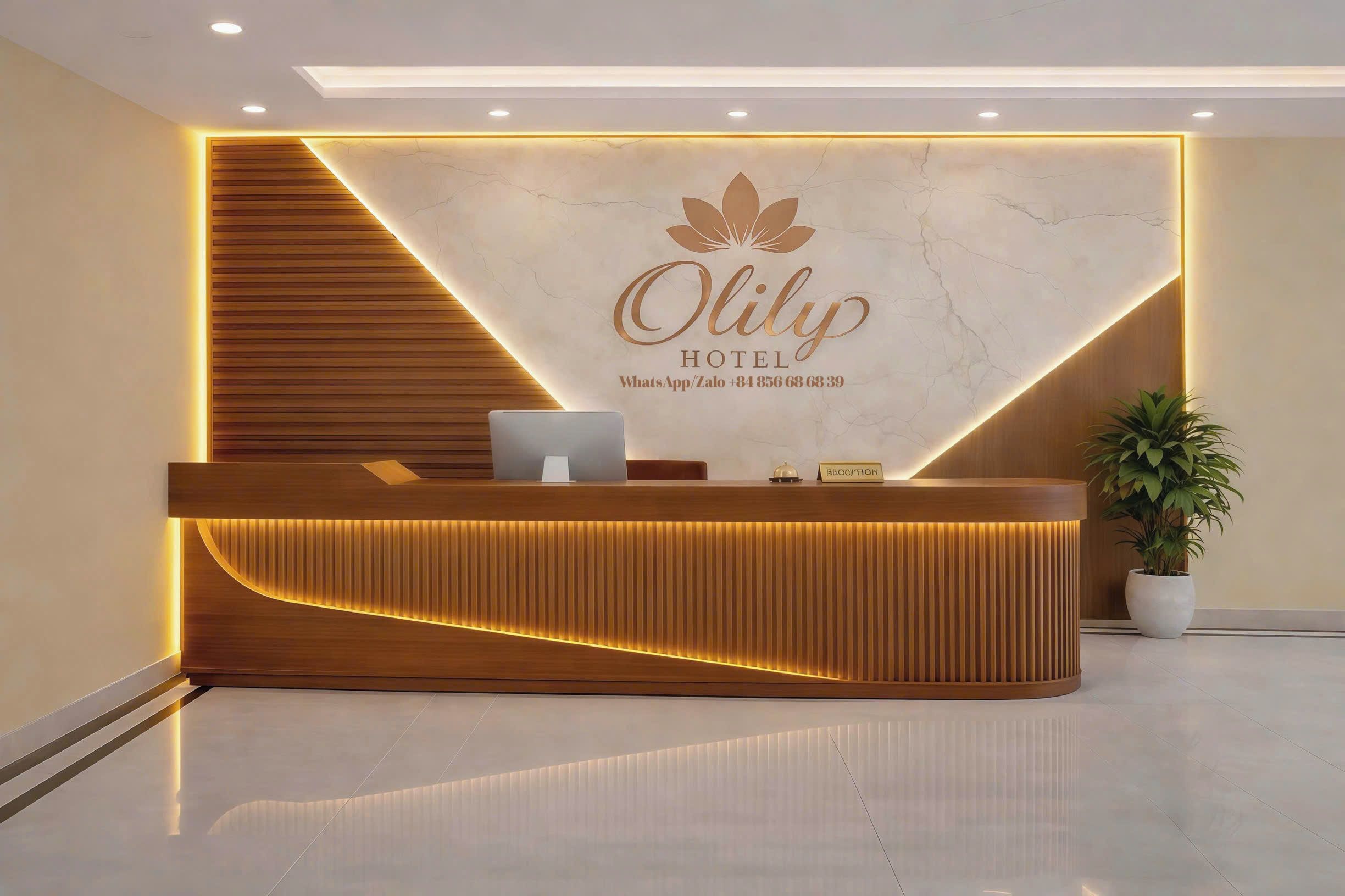 A hotel reception desk with a modern design, a marble wall, and a logo.