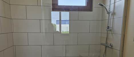 Shower, hair dryer, towels, toilet paper