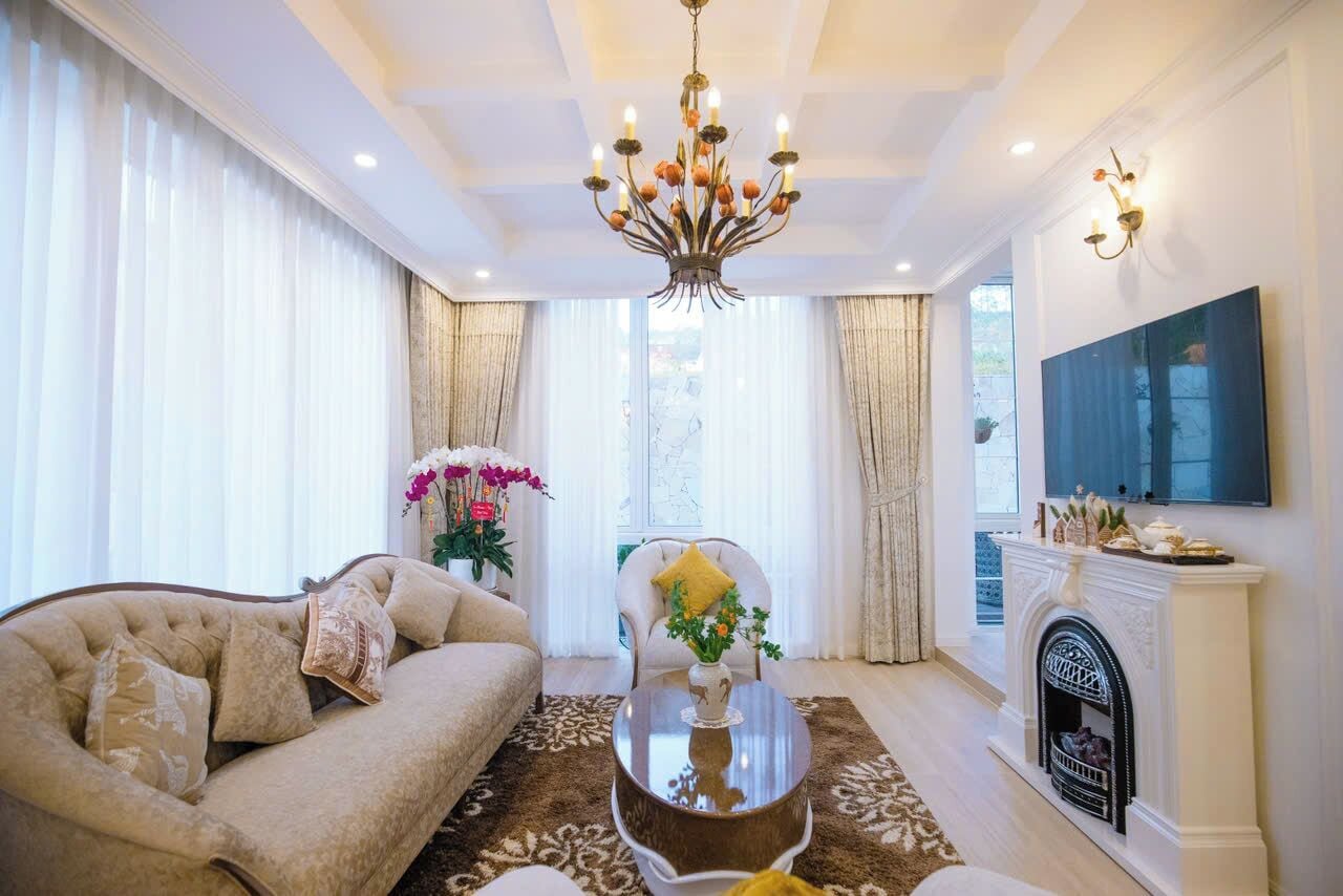 Deluxe Villa | Living area | 65-inch Smart TV with cable channels