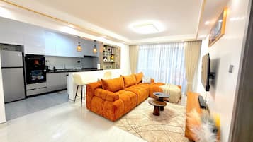 Apartamento standard, 2 quartos, sacada, vista para a cidade | Área de estar