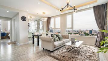 Premium Apartment, 2 Bedrooms, Kitchen, City View | Living area | 55-inch LED TV with cable channels, Netflix, streaming services