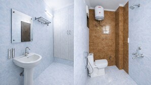 Un baño con lavamanos, espejo, armario, inodoro, ducha y calentador de agua.