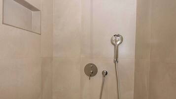 Shower, hair dryer, towels, shampoo