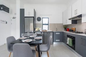Luxury Apartment, Executive Level (Luxury2-Bedroom Upper Floor Apartment) | Private kitchen | Full-size fridge, microwave, oven, stovetop