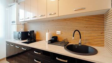 Fridge, microwave, stovetop, coffee/tea maker