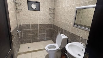 Family Suite, 3 Bedrooms | Bathroom | Hair dryer, slippers, towels, soap
