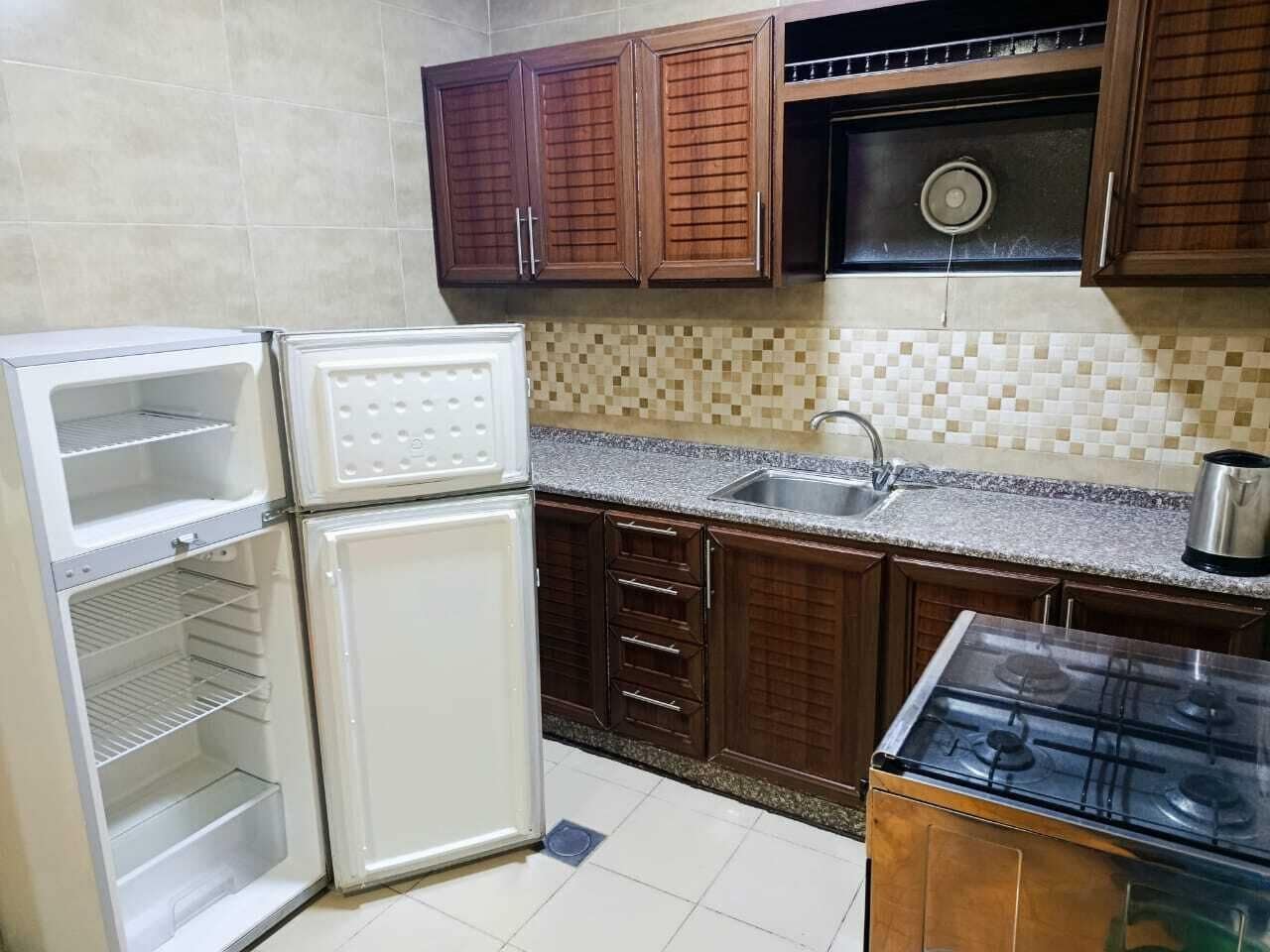 Suite, 2 Bedrooms | Private kitchen | Fridge, microwave, stovetop, electric kettle