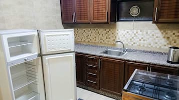 Suite, 2 Bedrooms | Private kitchen | Fridge, microwave, stovetop, electric kettle