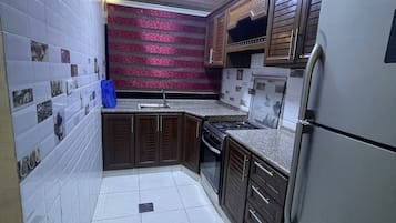 Family Suite, 3 Bedrooms | Private kitchen | Fridge, microwave, stovetop, electric kettle