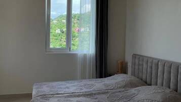 Double or Twin Room, Garden View | Desk, laptop workspace, blackout drapes, soundproofing