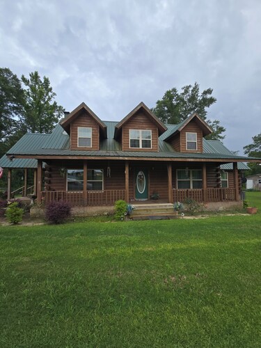 3-bedroom log cabin backs up to wooded lot for maximum peace and quiet!