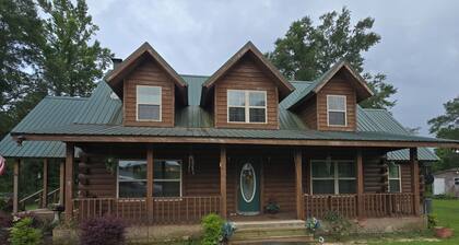 3-bedroom log cabin backs up to wooded lot for maximum peace and quiet!