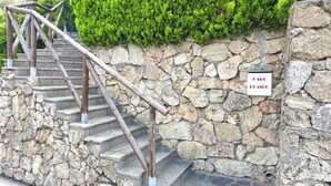A stone staircase with metal railings leading to a door marked 'Casa Francesca.' - Hostdomus - Plasch Studio (Finale Ligure)