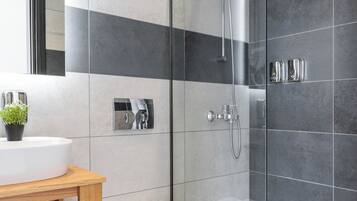 Shower, eco-friendly toiletries, hair dryer, towels