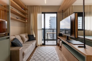 Basic Apartment | Living area - Studio recém-construído no coração da Vila Olímpia (São Paulo)